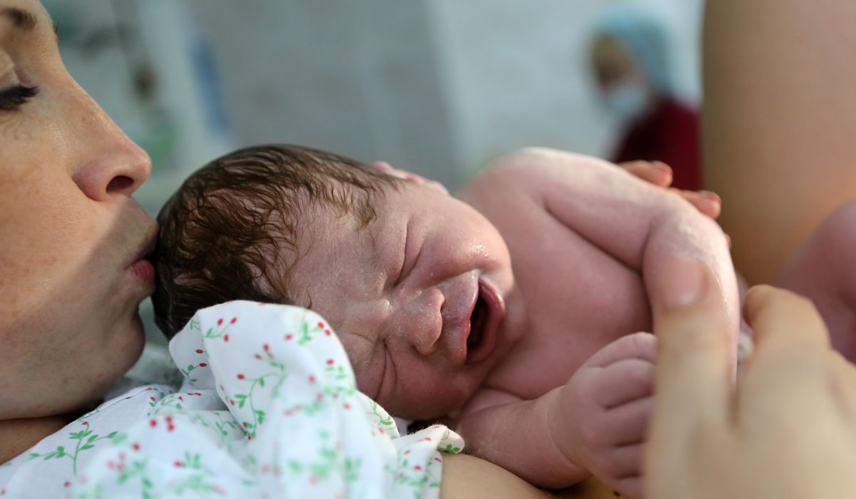 Woman with newborn baby after giving birth