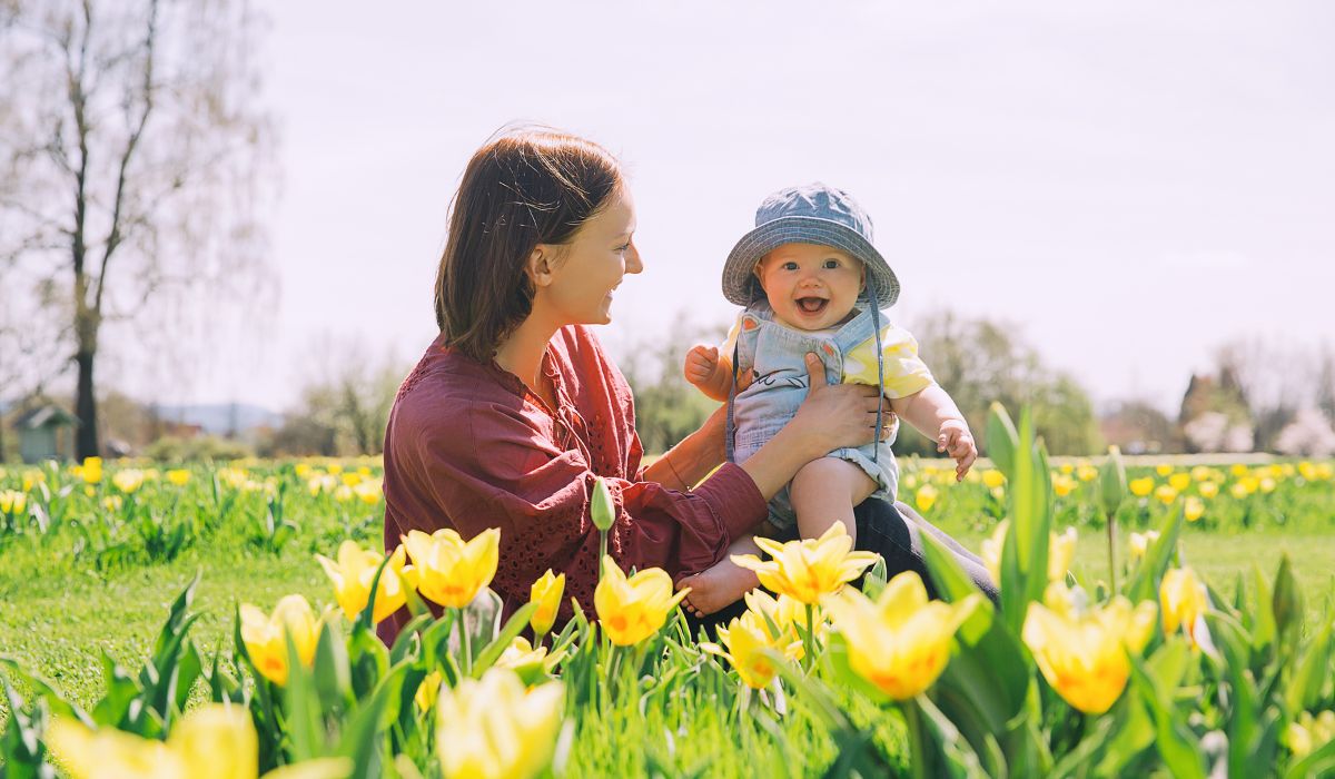 Mother with her baby in spring