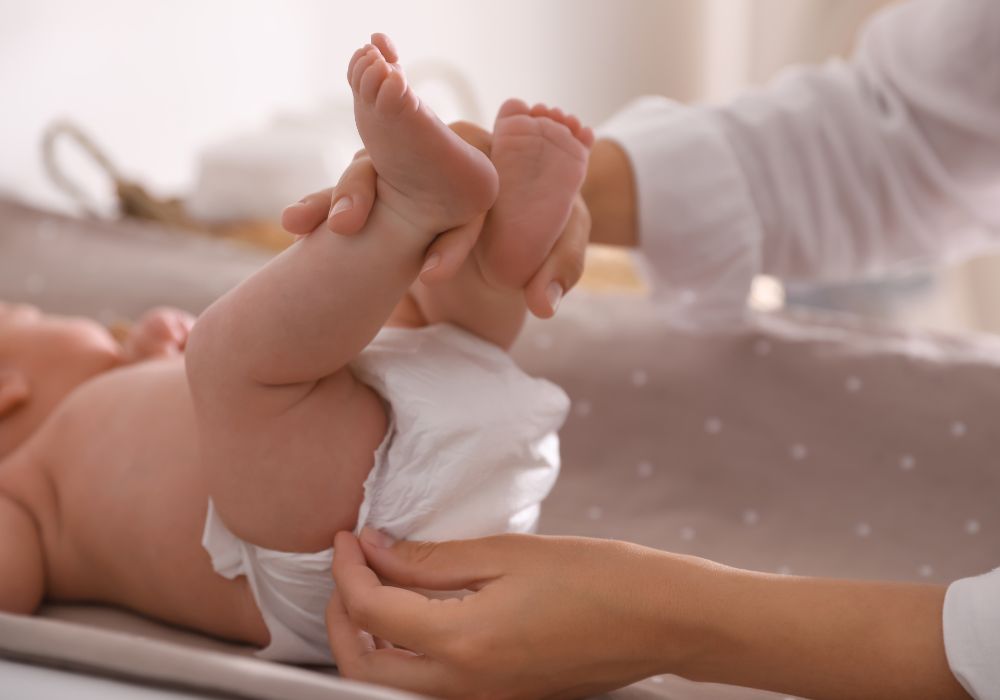Baby having nappy changed