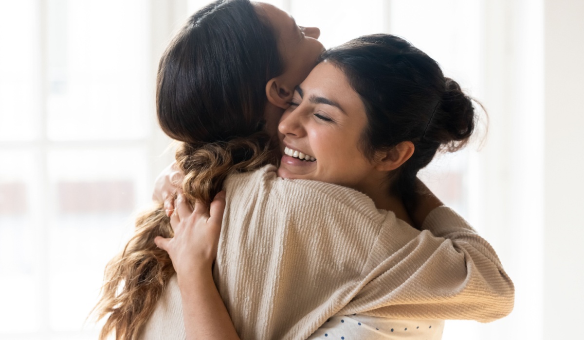 Two women hugging