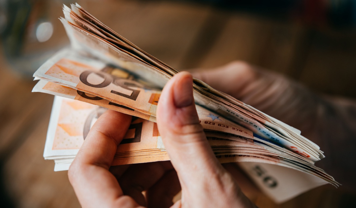 Woman counting Euro notes