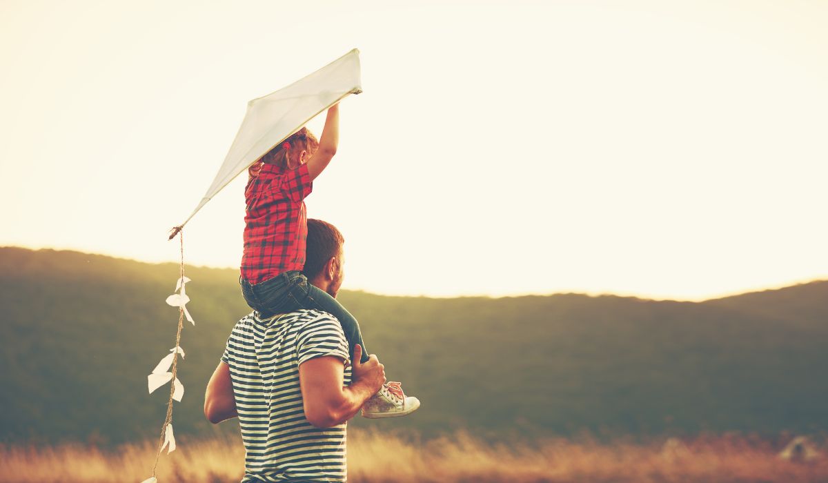 Dad and son flying kite