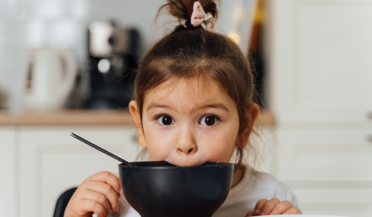 Little girl eating.