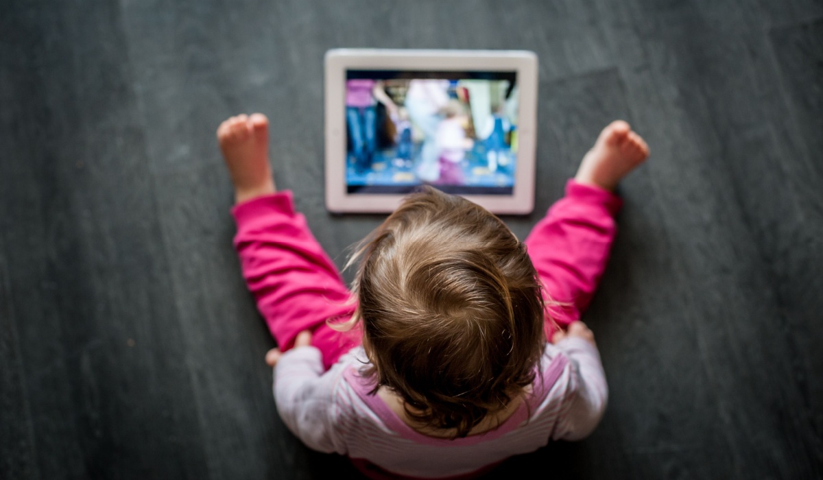 Toddler looking at iPad