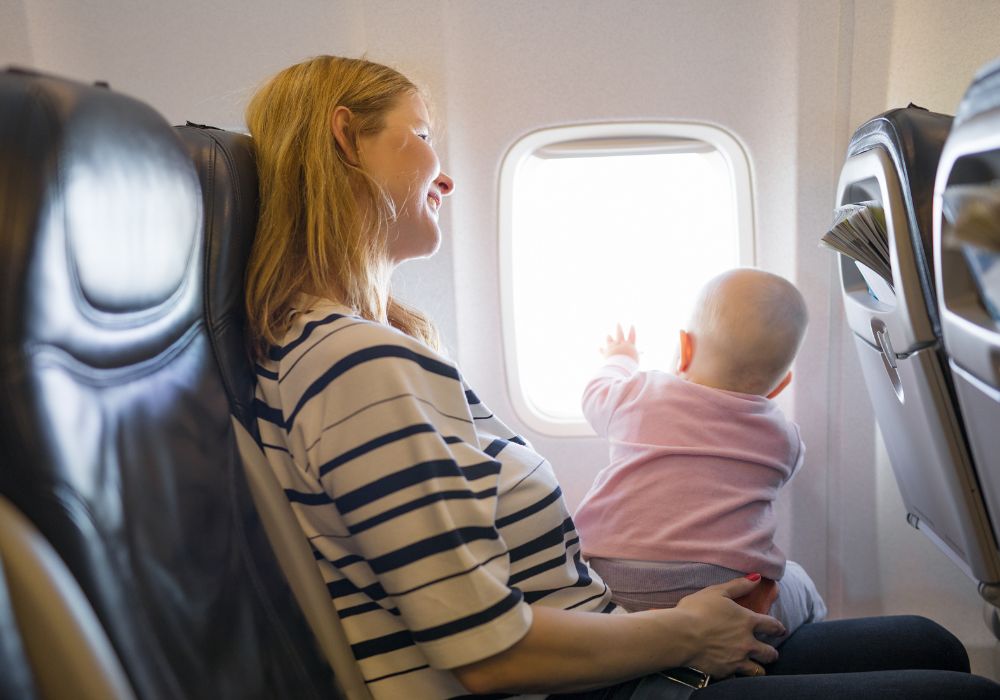 Mother on plane with baby