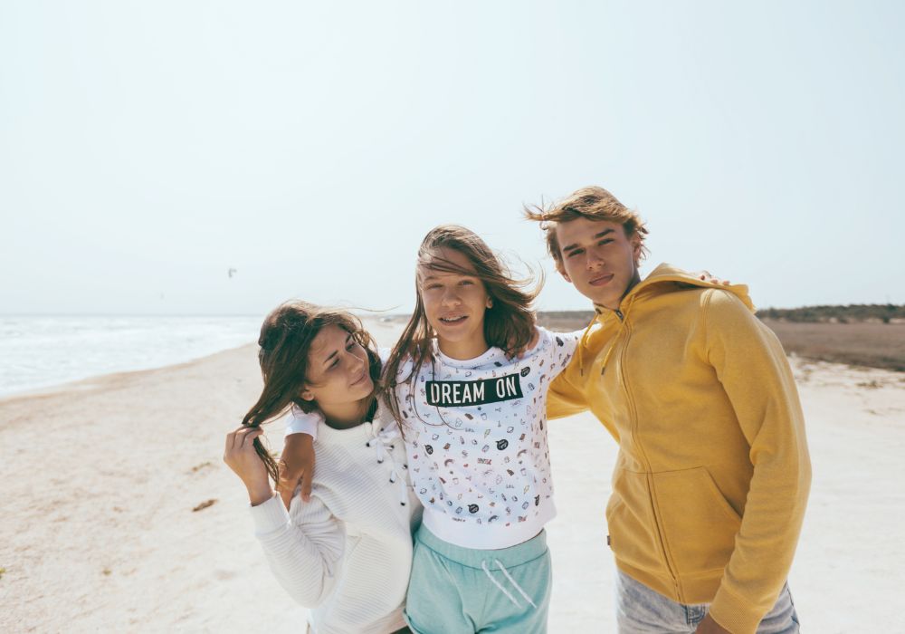Tweens hanging out on beach