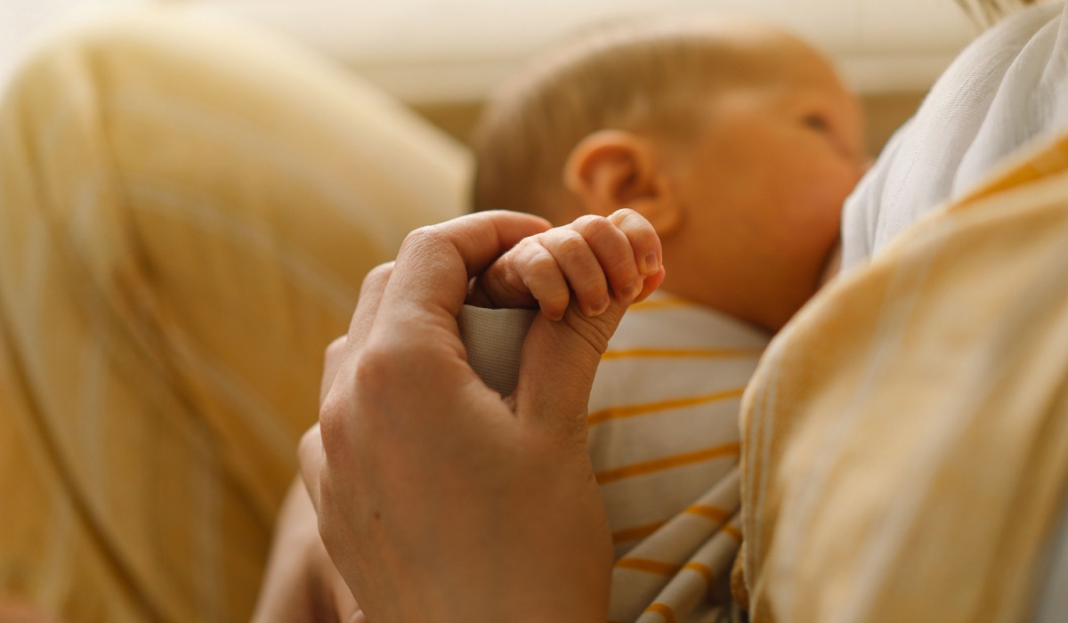 Mother breastfeeding newborn
