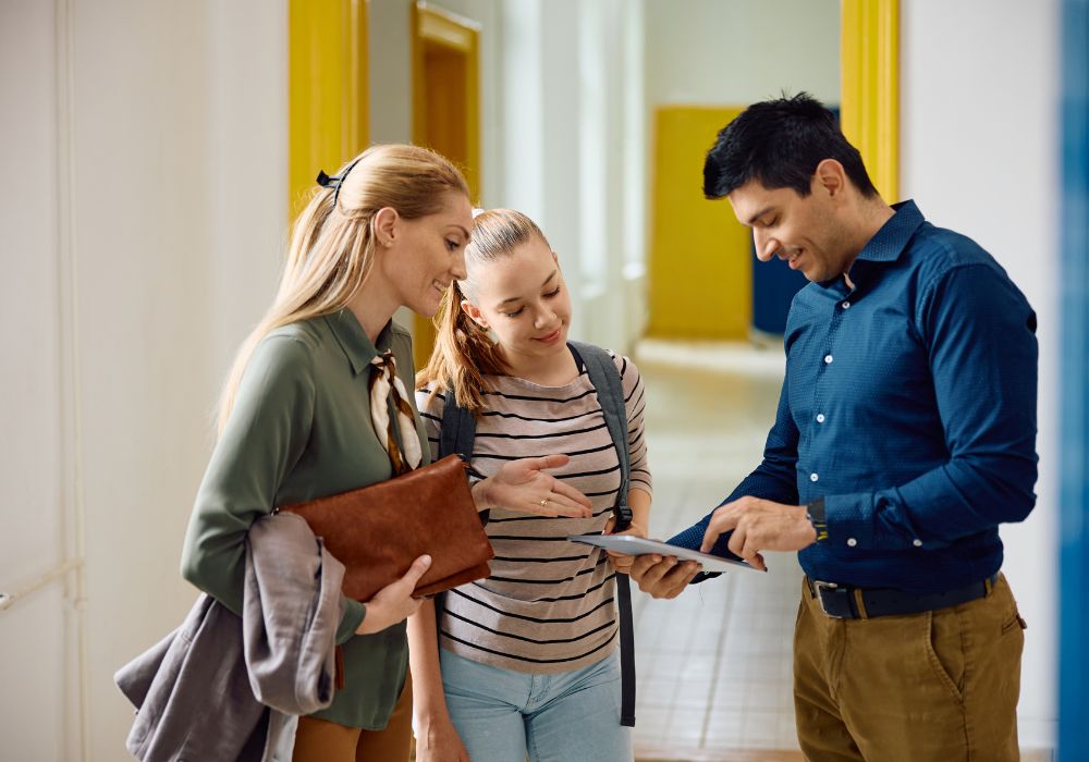 parents and teenage daughter at school