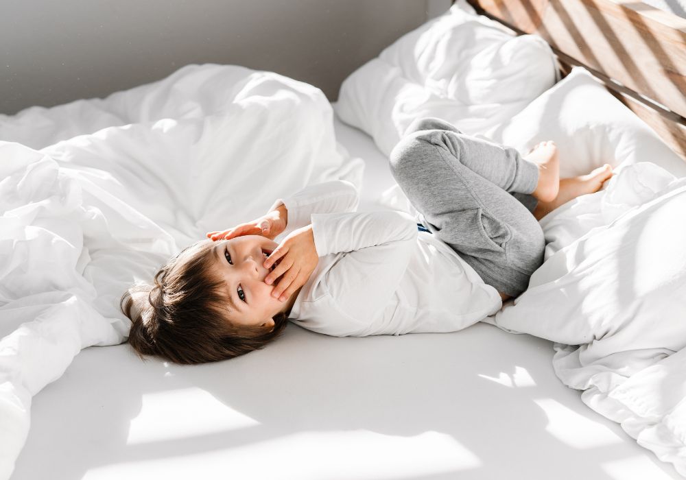 Child in hotel bed