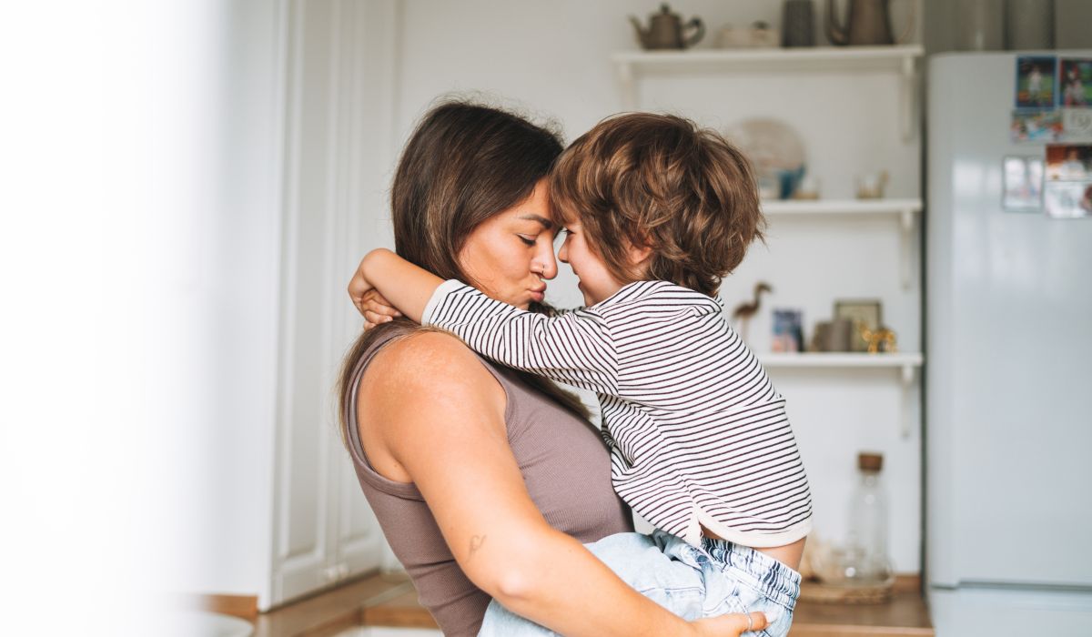 Mother holding toddler son