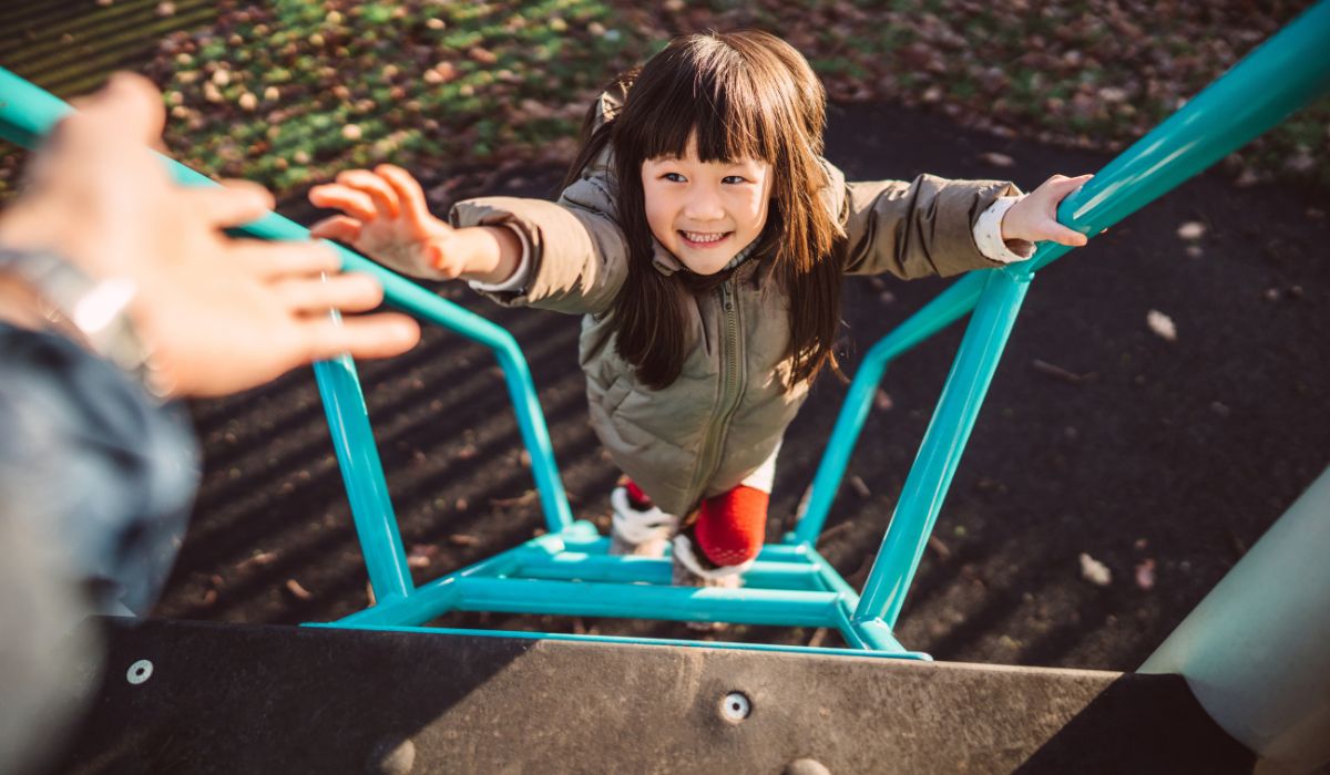 Child climbing up slide