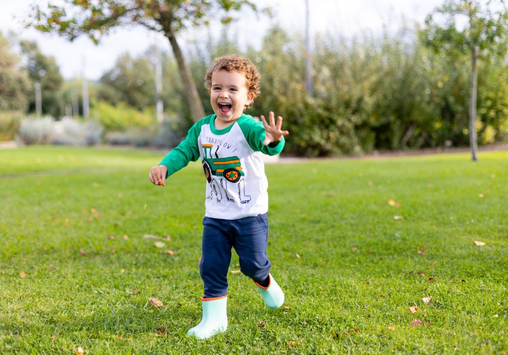 Little boy playing in the grass