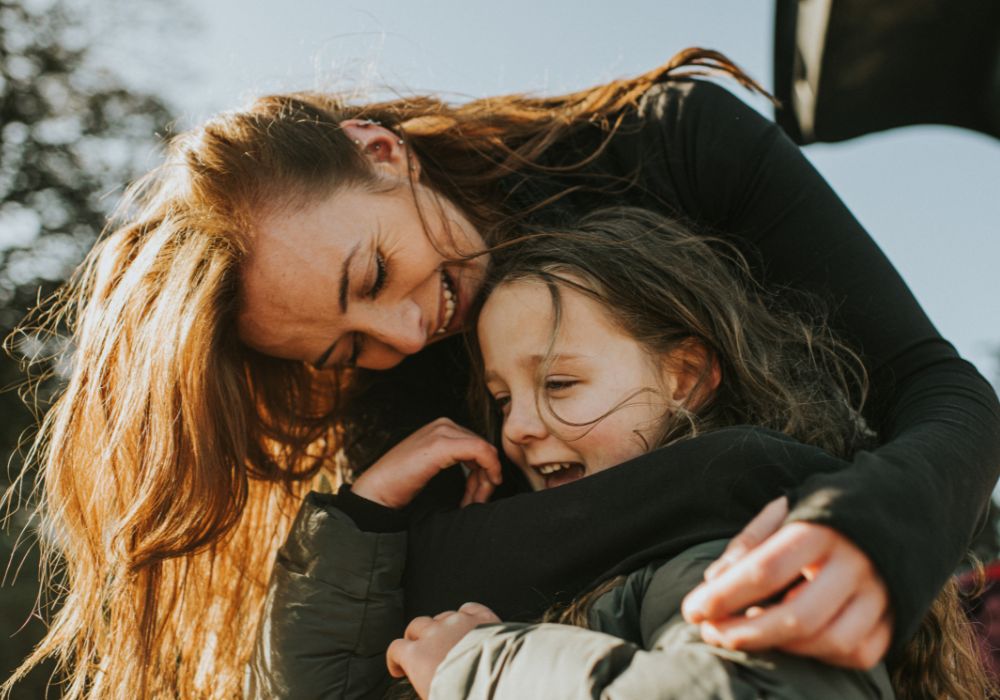 Mother cuddling child