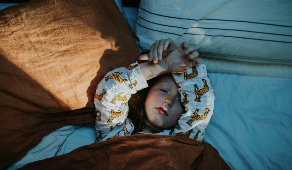 Sick child in bed