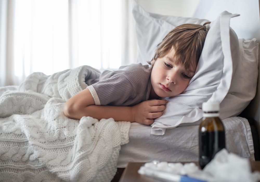 Sick child lying in bed