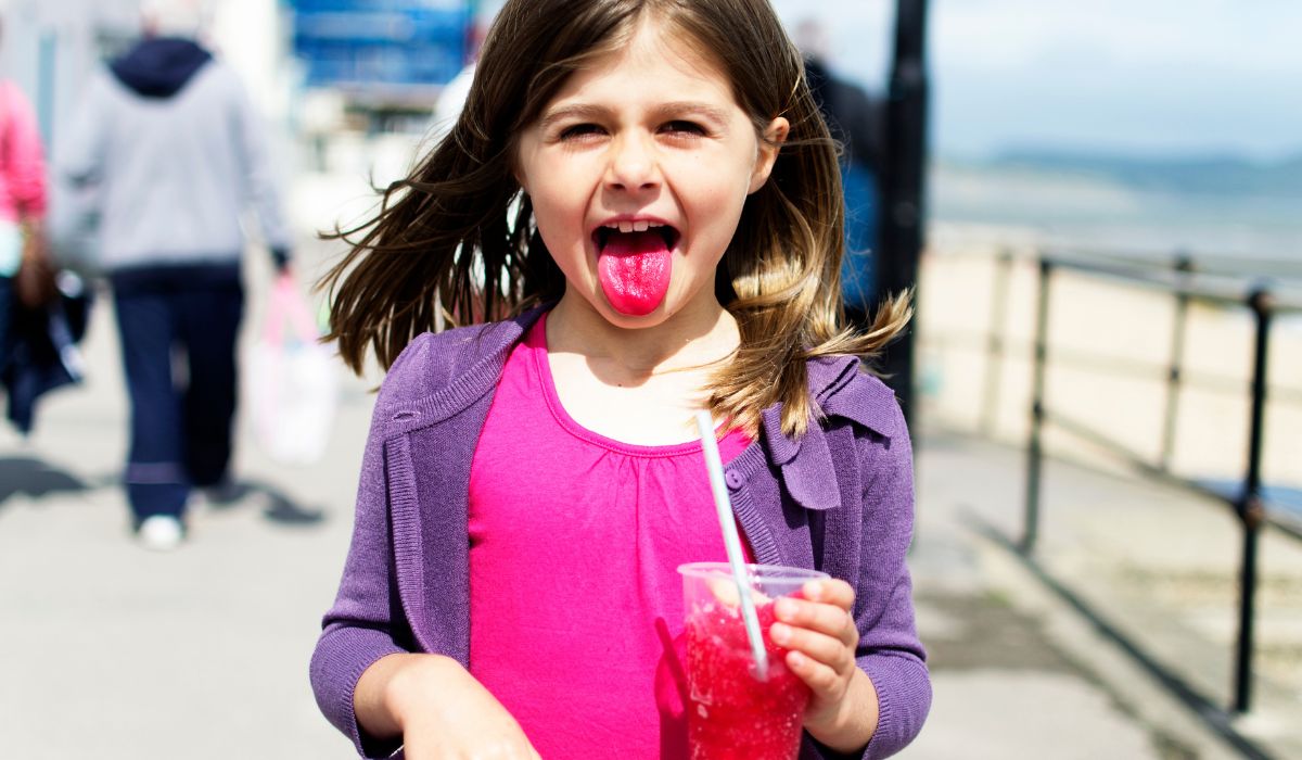 Little girl drinking slushie