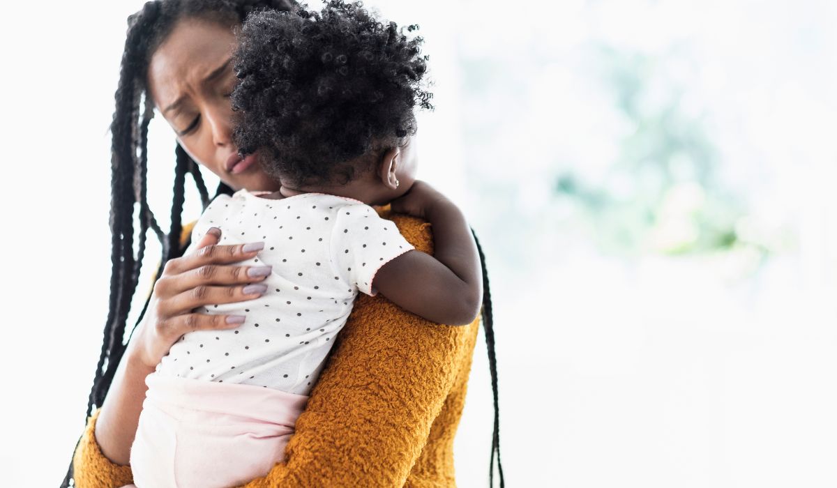 mother holding baby girl