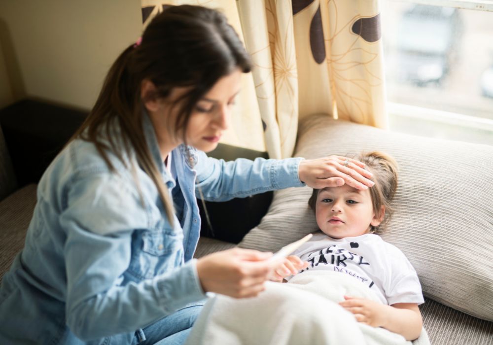 Mother checking child's temperature