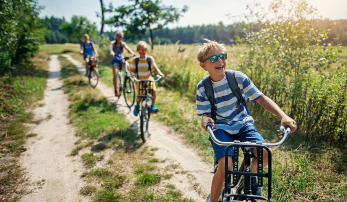 Kids on their bike in summer