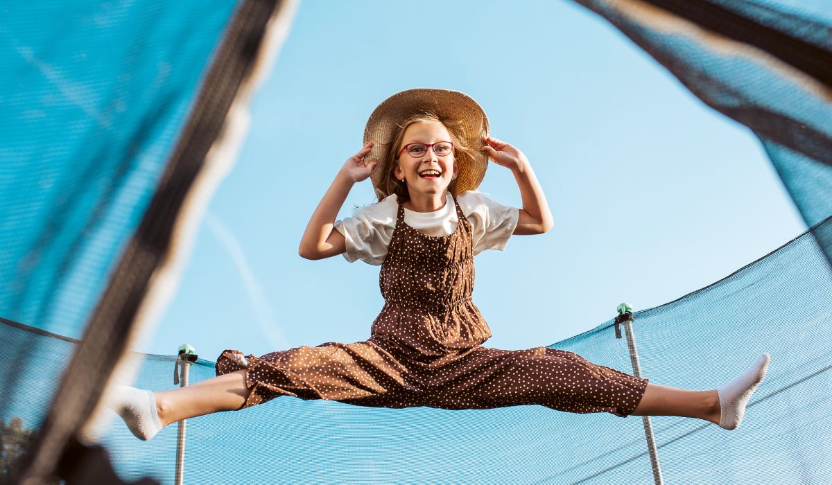 Child jumping on trampoline
