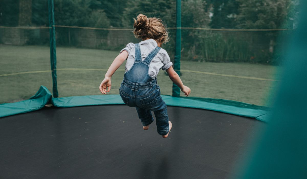 Child jumping on trampoline