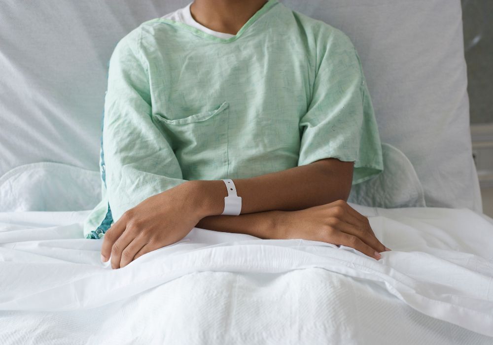 Boy sitting in hospital bed