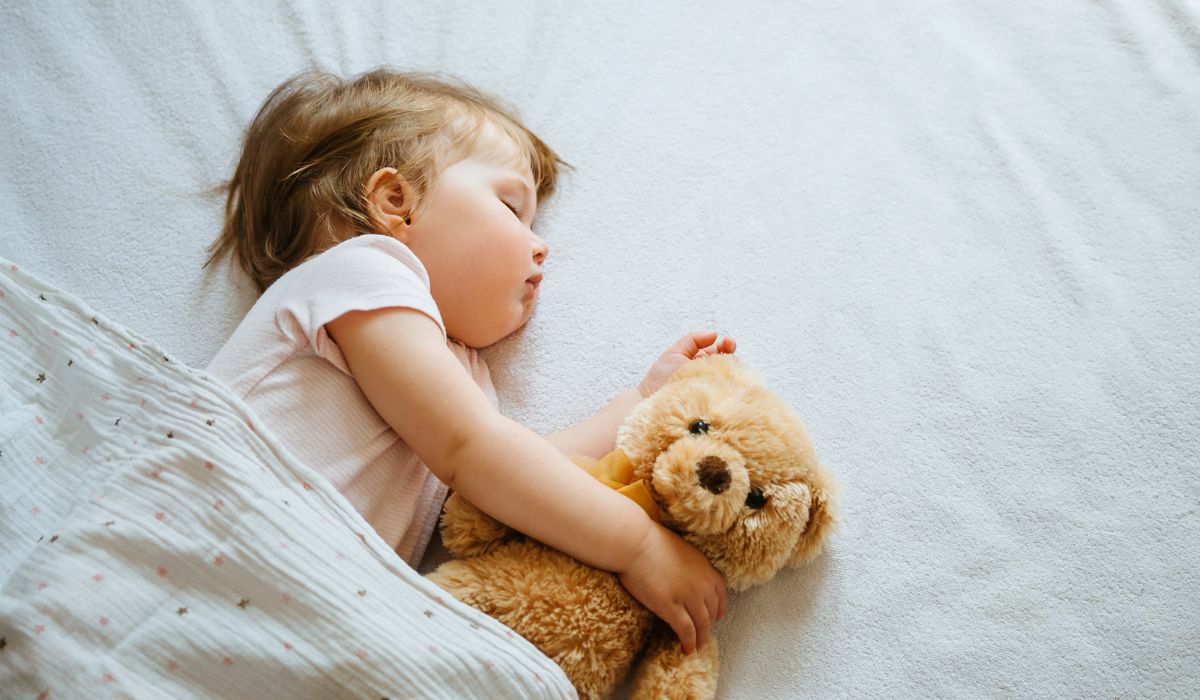 Baby asleep in cot