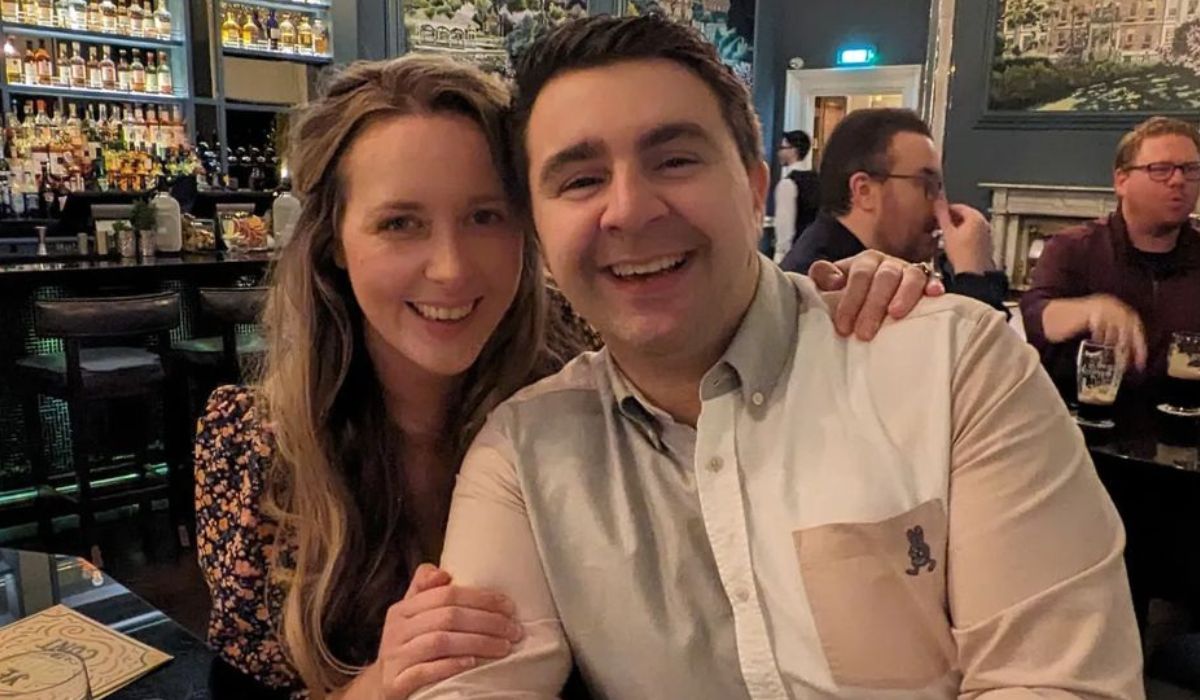 Carl Mullan and wife posing for a photo