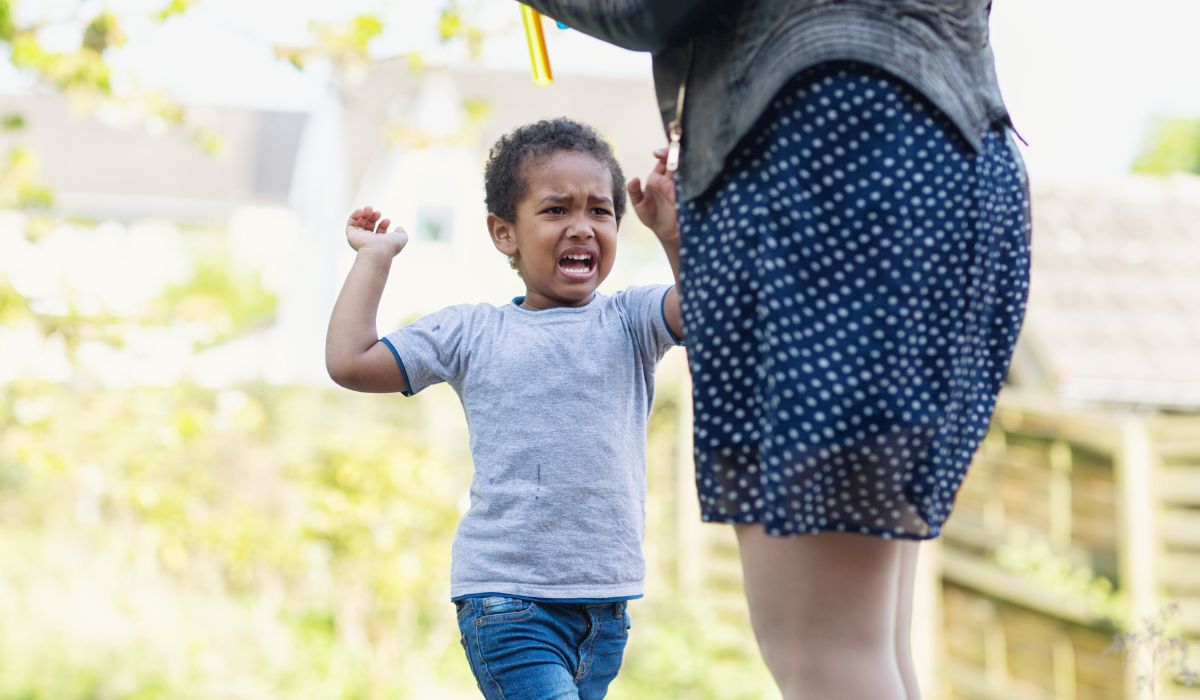 Boy hitting a woman