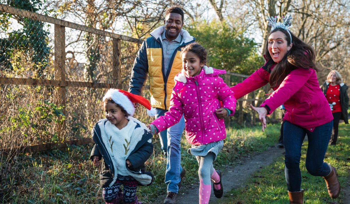 Family celebrating outside at Christmas