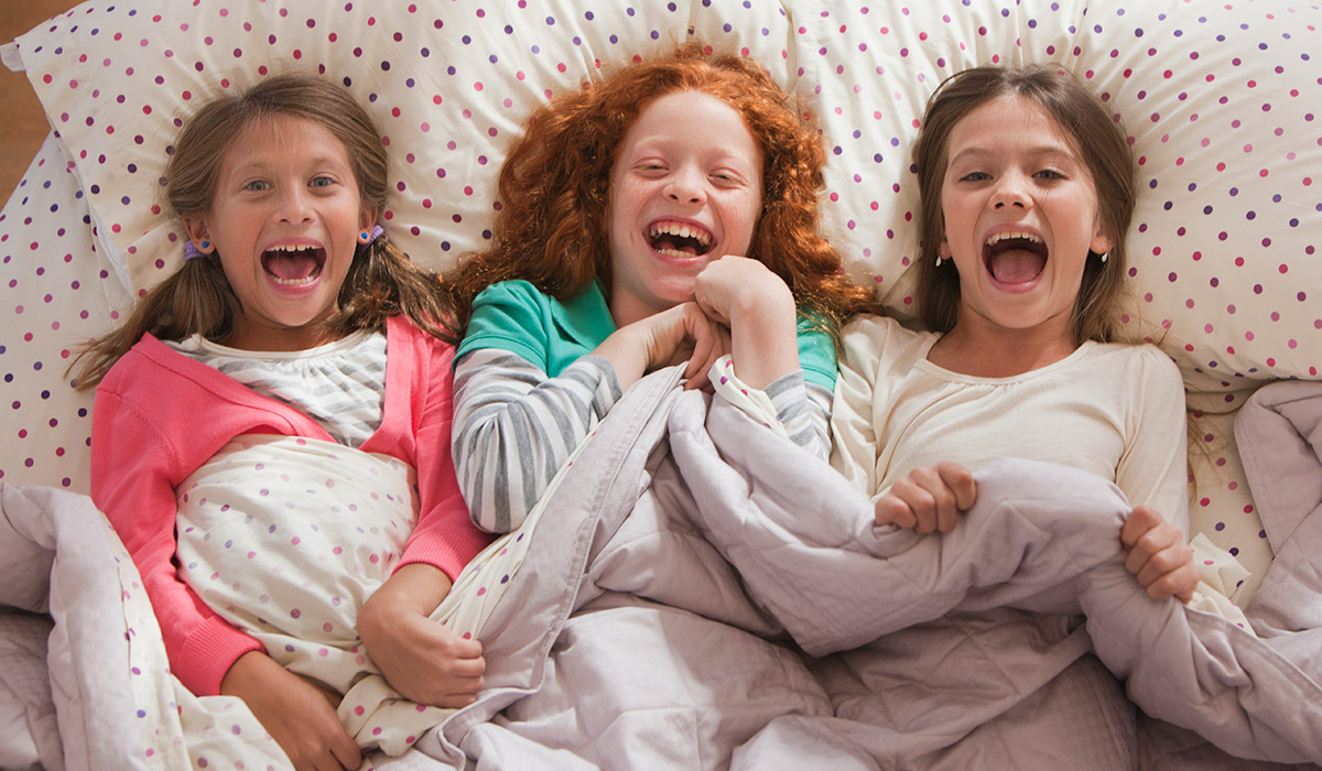 Laughing girls on a sleepover. Pic: Getty Images