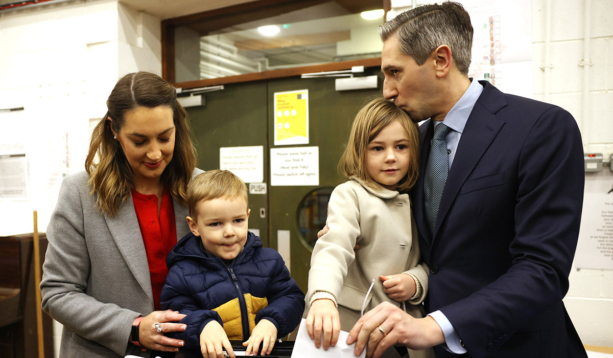 Taoiseach Simon Harris arrives with his wife Caoimhe Wade and his son Cillian, 3, and daughter Saoirse, 5, to cast their votes during the Irish general election at Delgany National School on November 29, 2024 in Wicklow, Ireland. 174 Teachtaí Dála (TDs) will be elected across 43 constituencies to Dáil Éireann, the lower house of the Oireachtas, Ireland's legislature. In 2023, the number of TDs increased from 160 and constituencies from 39 to 43 making this the largest Dáil in its history. (Photo by Dan Kitwood/Getty Images)