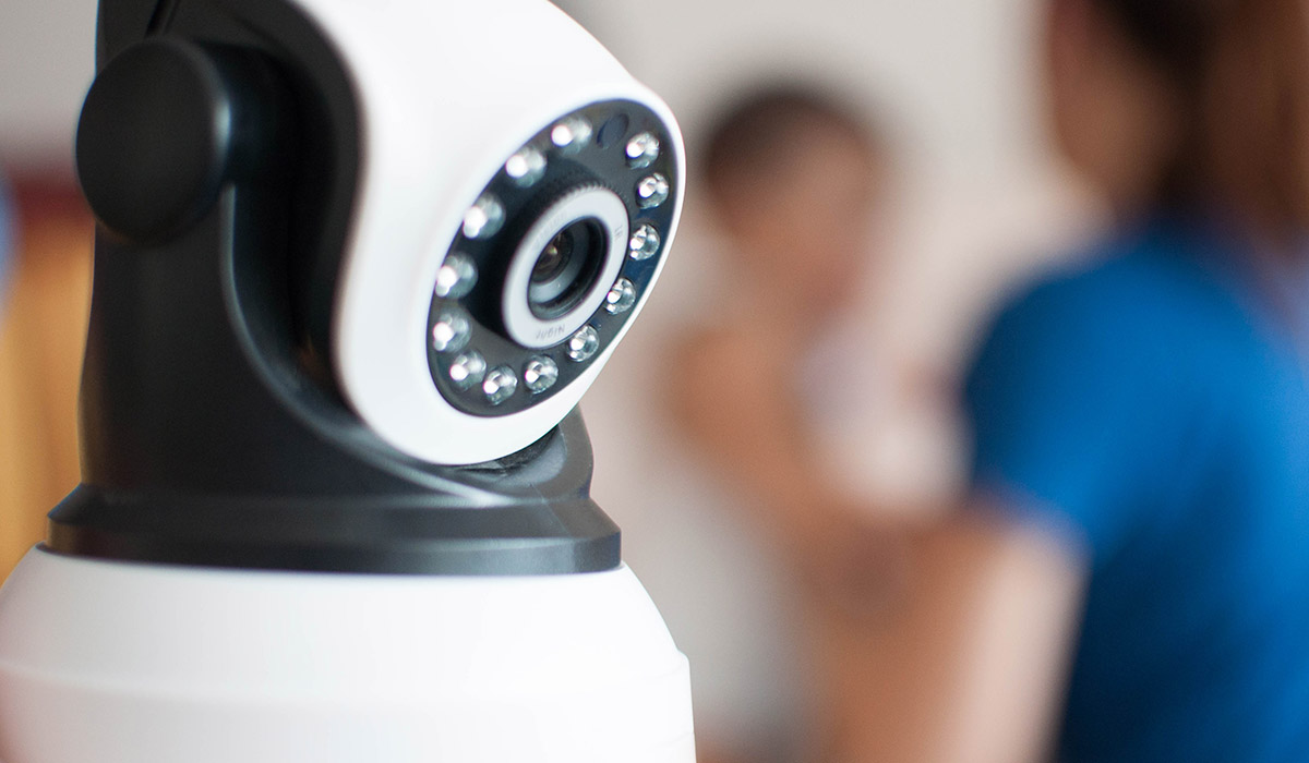 A concept of security camera watching a baby for security