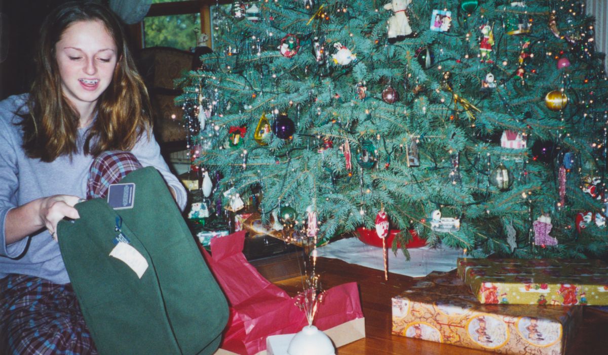 girl in front of a christmas tree in the '90s
