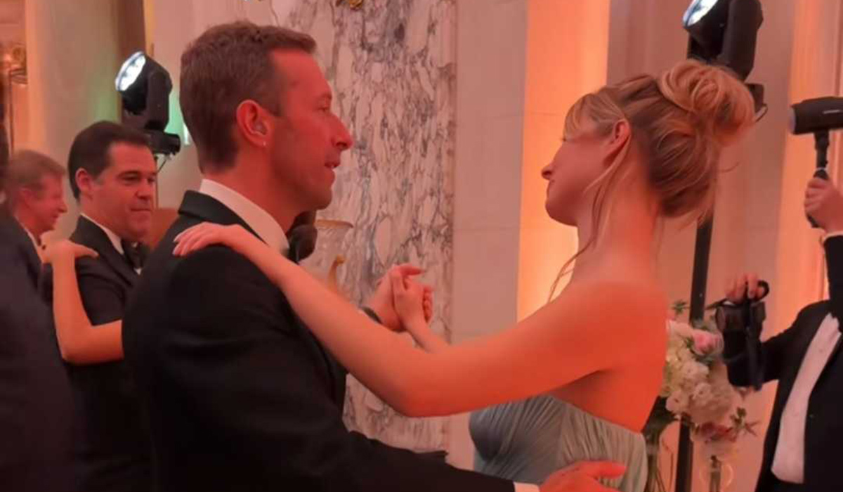 Chris Martin dancing with his daughter Apple at the ball. Pic: TikTok