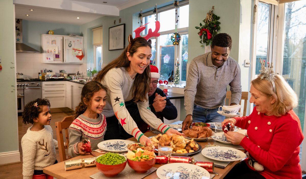 Family sitting down for dinner on Christmas Day