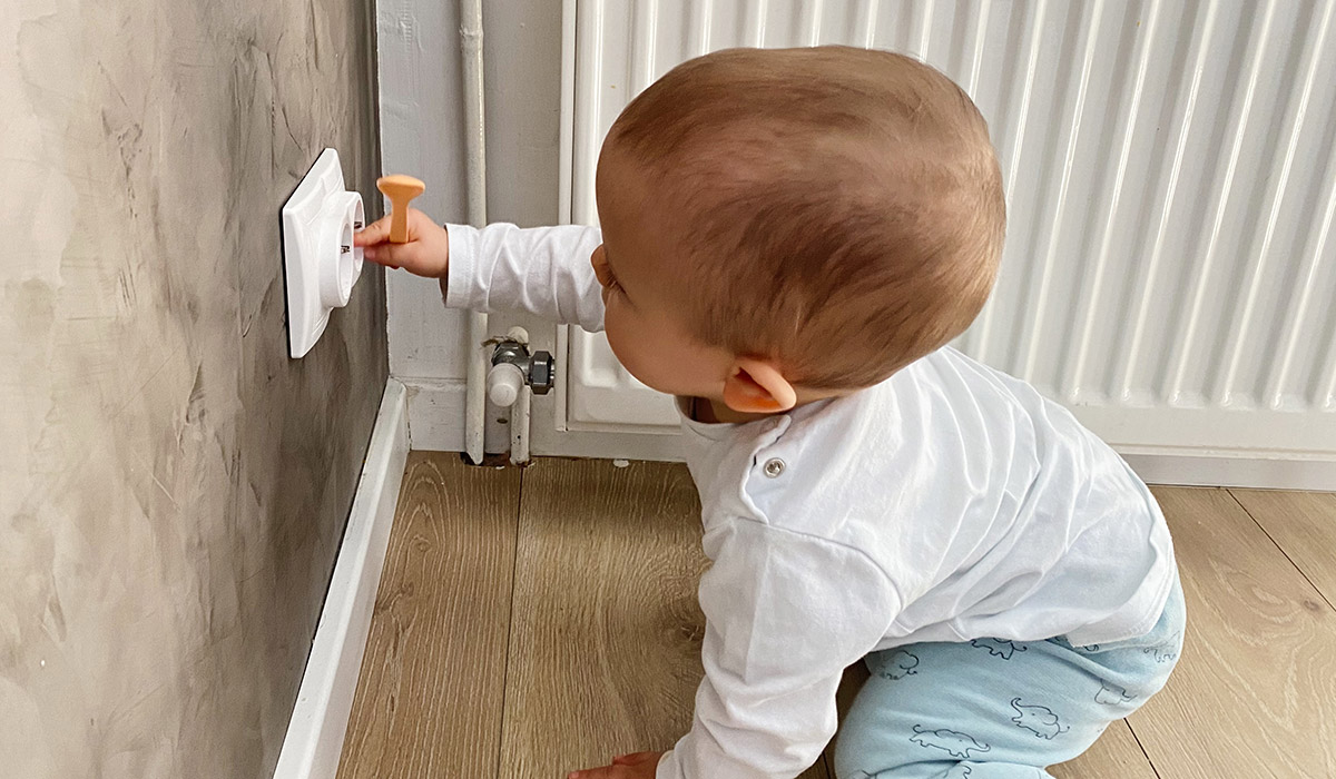 Baby boy crawling in corridor at home, not knowing the danger.