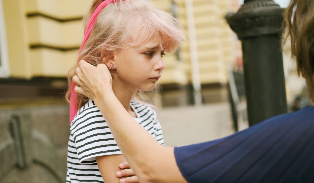 Mother comforting sad daughter