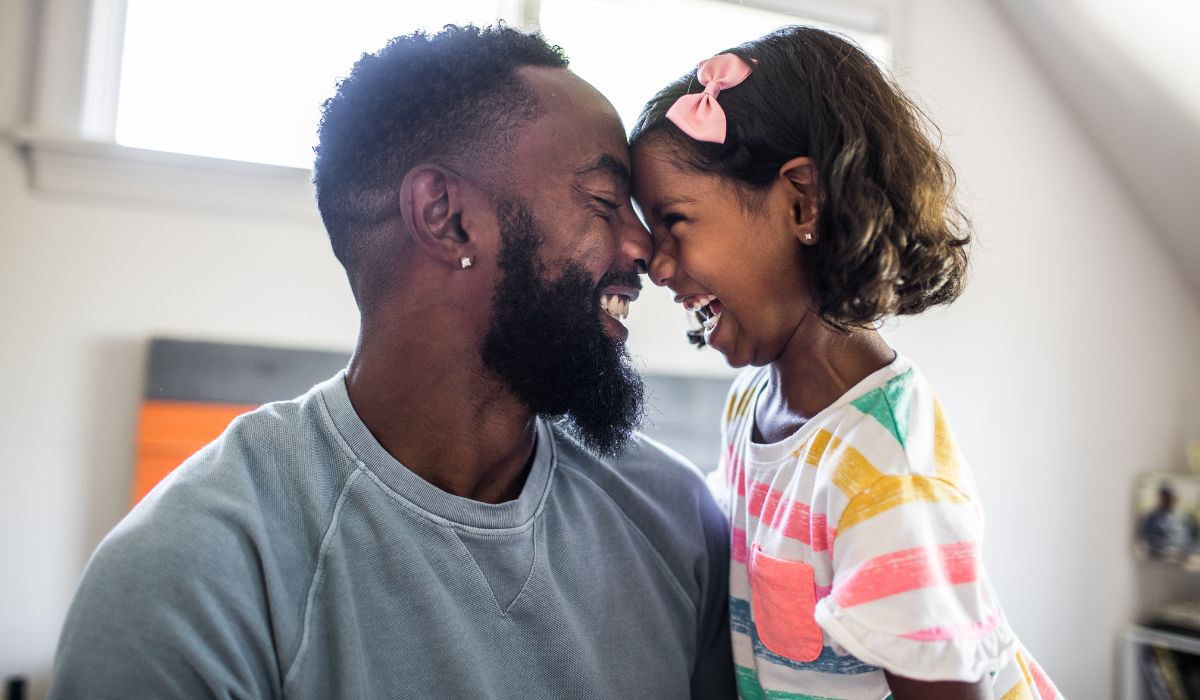 Father and daughter smiling