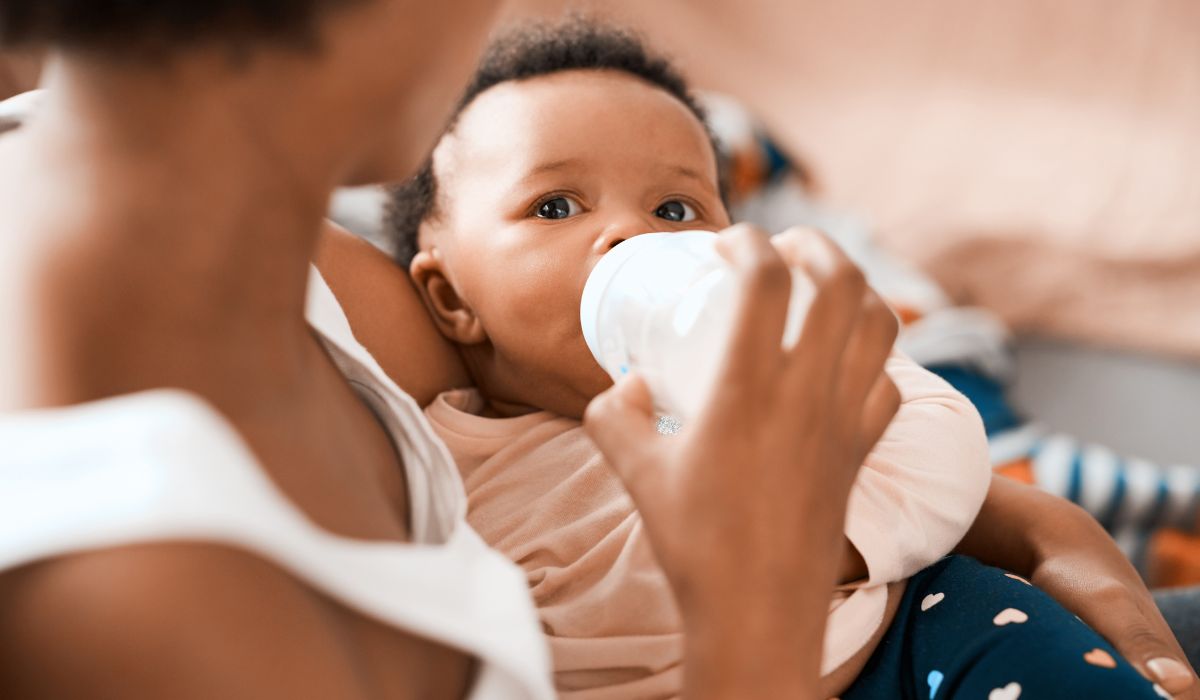Mother feeding baby bottle