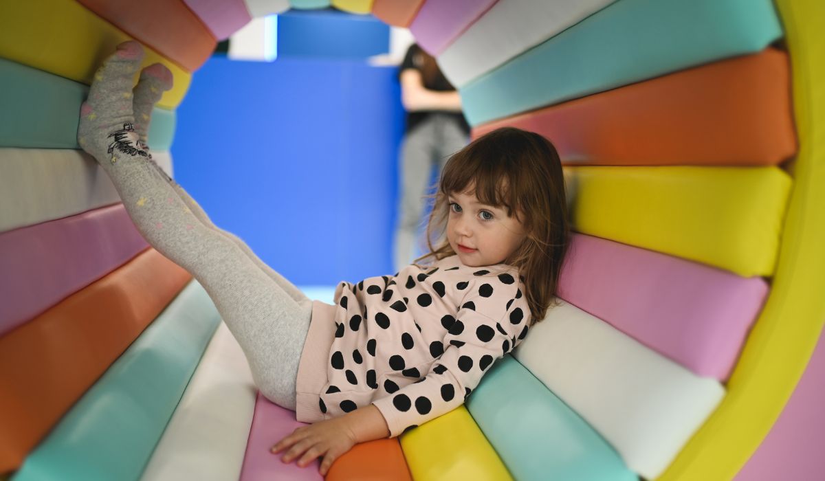 Child playing in soft play