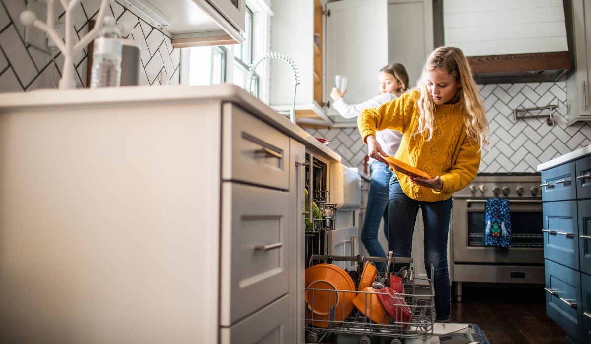 Kids cleaning up in the kitchen