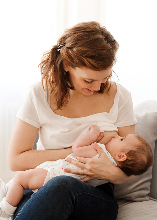 Woman breastfeeding her child. Pic: Getty Images