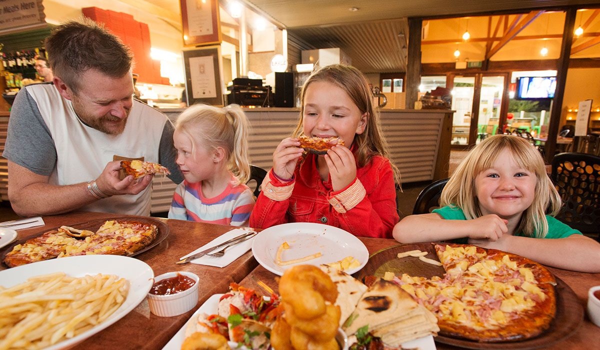 Family eating seafood at restaurant. Pic: Getty Images