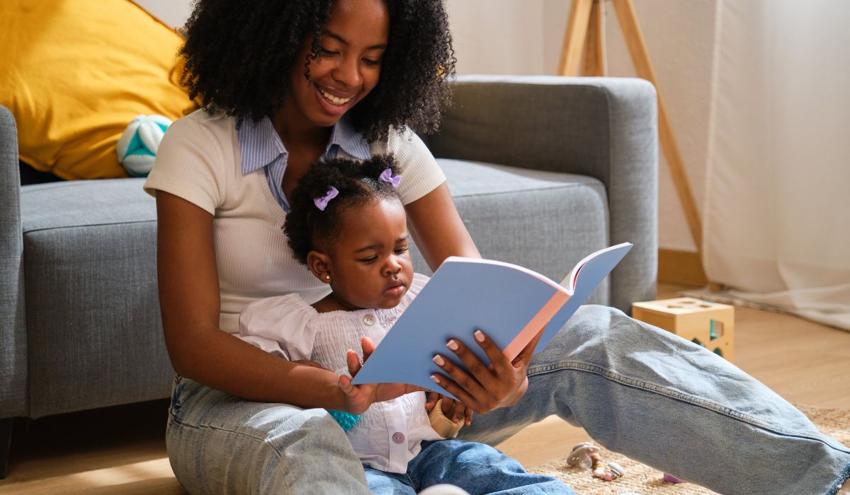 Mother reading to baby girl