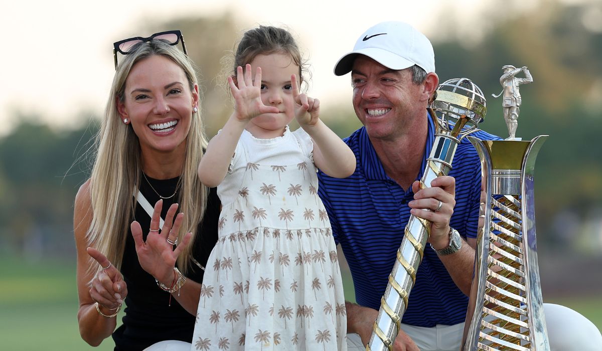 Rory McIlroy of Northern Ireland smiles with his Wife, Erica Stoll and Daughter, Poppy