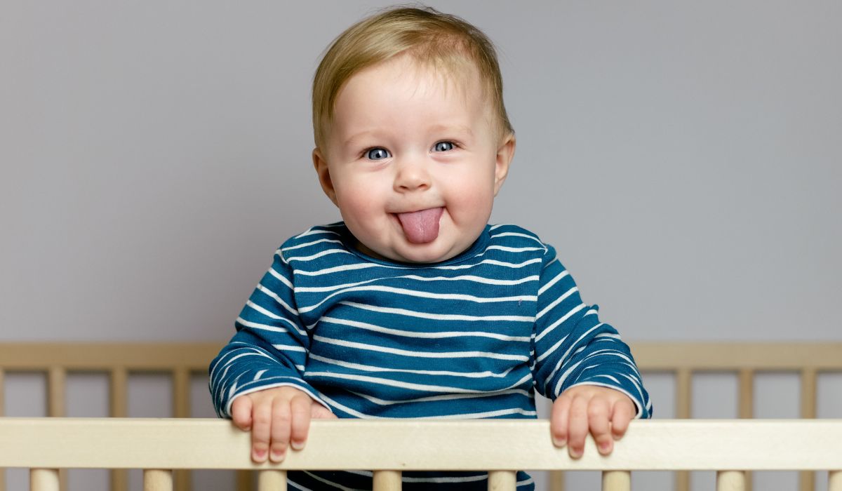 Baby boy sticking his tongue out