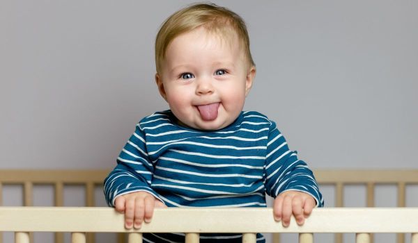 Baby boy sticking his tongue out