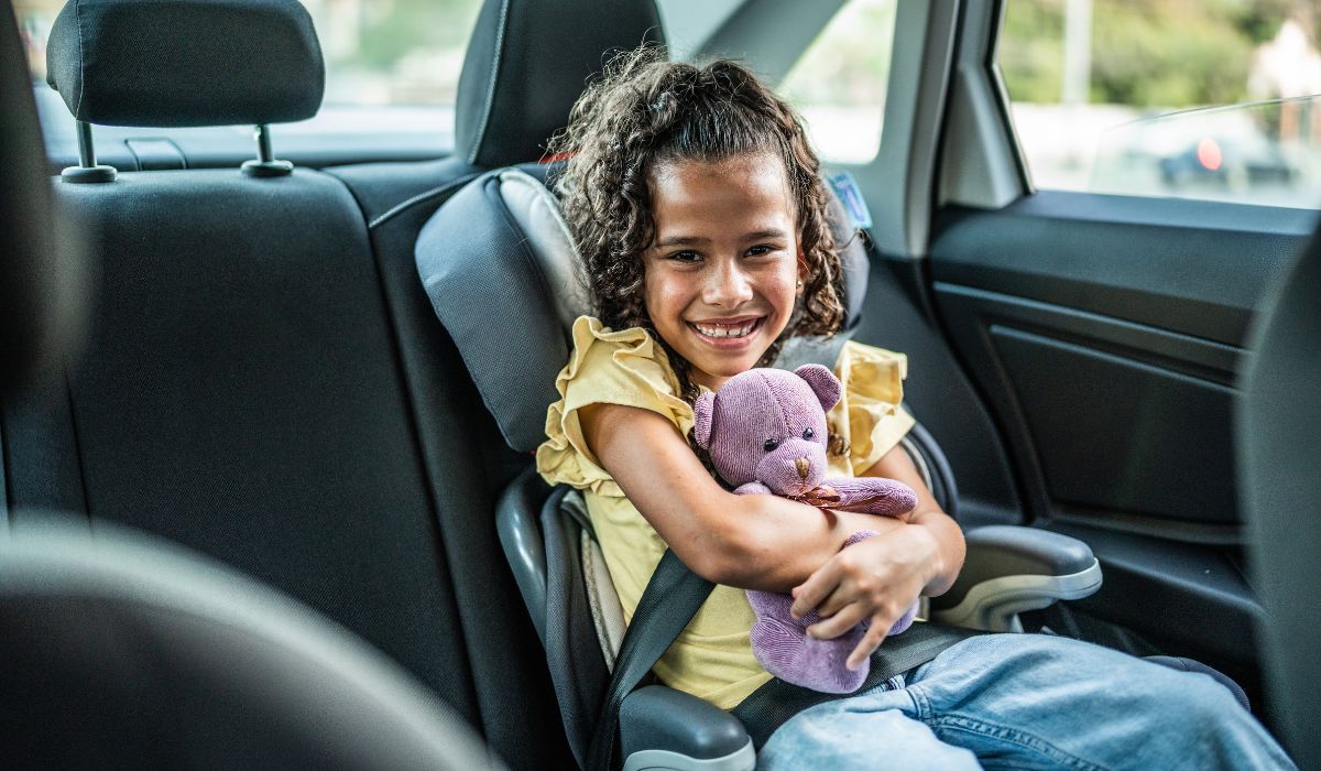 Little girl in booster seat