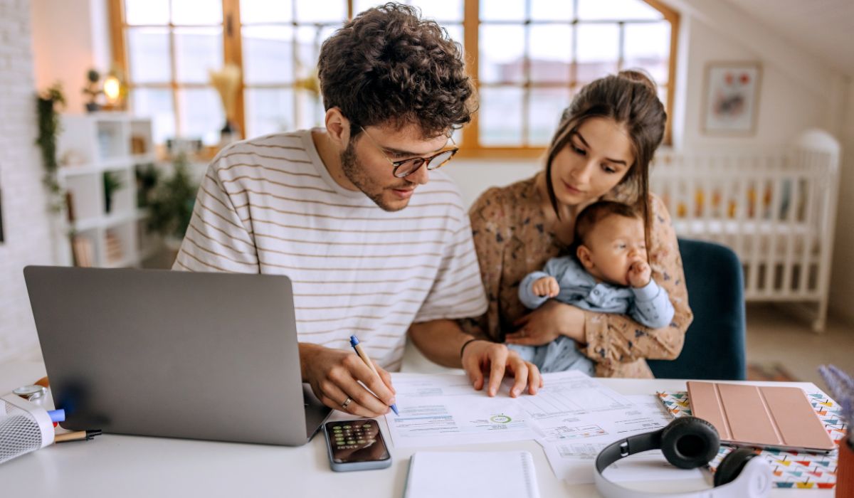 Parents sitting at computer budgeting